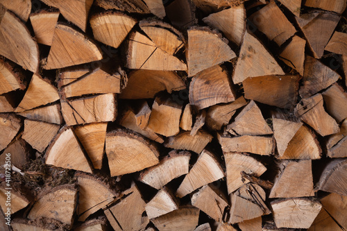 Firewood texture. Pile of dry chopped fire wood background