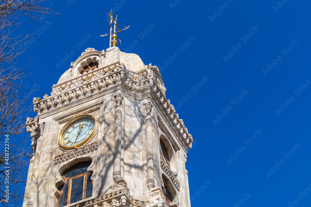 Fototapeta premium The clock tower in front of Yildiz Hamidiye Mosque.