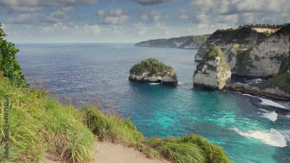 Scenic descent to Diamond beach along scenic trail carved into the rock in the background Diamond Beach – Most Beautiful Beach on Nusa Penida in Bali. 4K Scenic descent to Diamond beach along scenic trail carved into the rock in the background Diamond Beach – Most Beautiful Beach on Nusa Penida in Bali. 4K