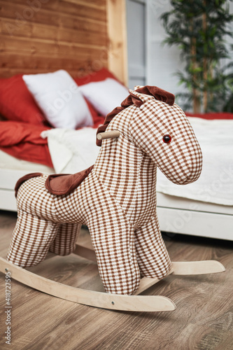 children's wooden rocking horse in the interior