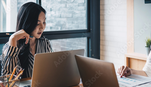 Young business teamwork using laptop with business report document and Brainstorming Planning Partnership