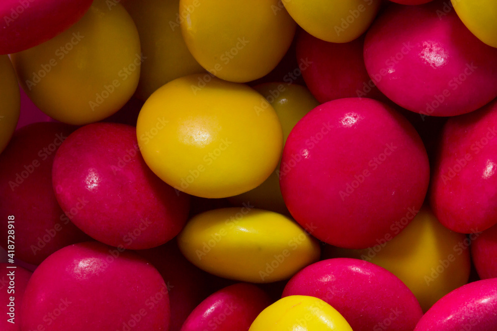 Colourful close up of sweets and candy. Coloured chocolate for desert Colourful close up of sweets and candy. Coloured chocolate for desert
