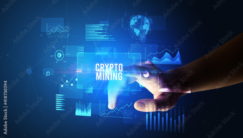 Hand touching CRYPTO MINING inscription, new business technology concept Hand touching CRYPTO MINING inscription, new business technology concept