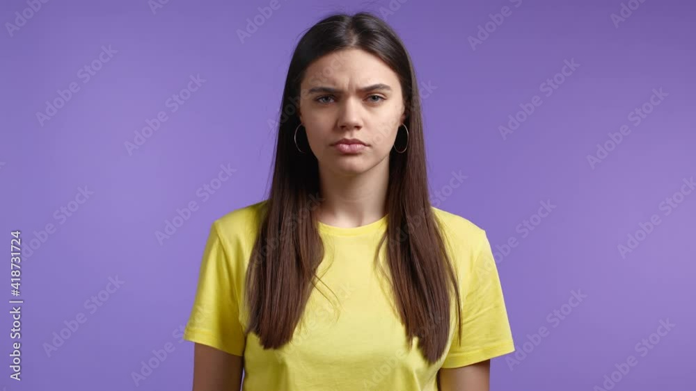 Inflexible woman disapproving with no head sign, nods head