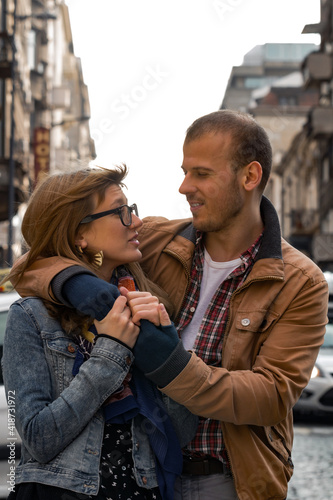 Young couple enjoying on the urban streets.