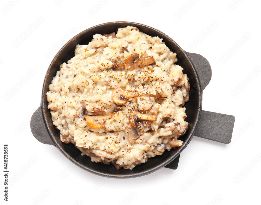 Frying pan with tasty risotto on white background