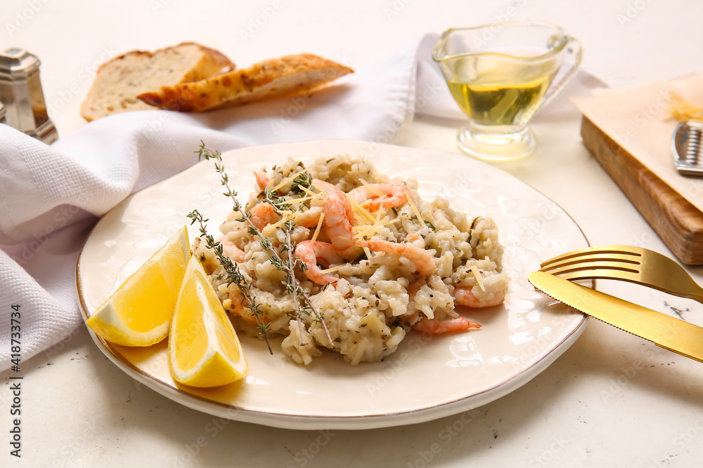 Plate with tasty risotto on light background Plate with tasty risotto on light background
