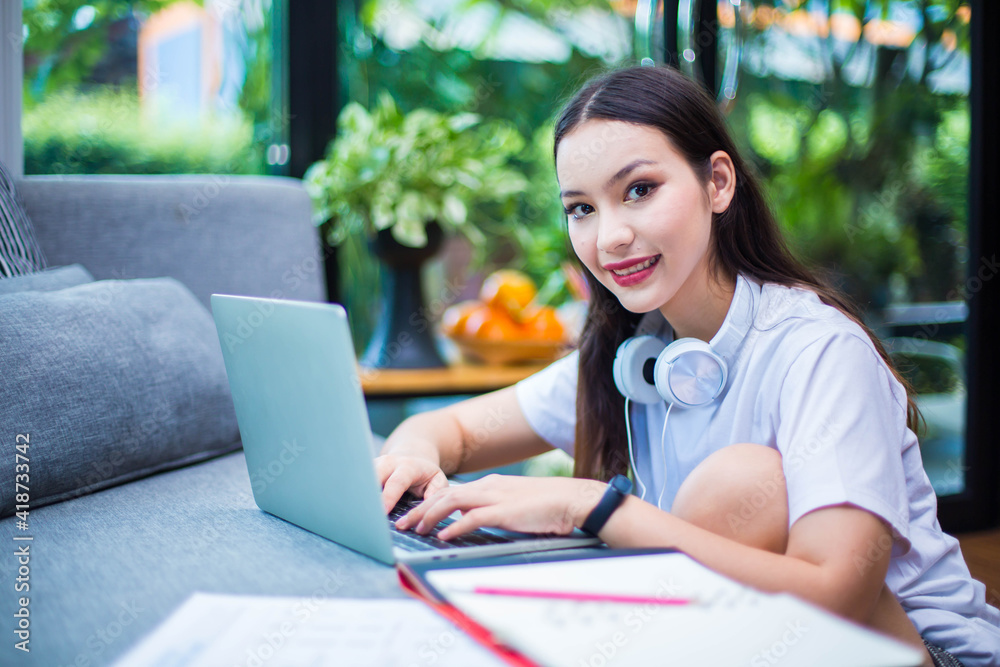 A beautiful woman working with freelance at home with happiness Because the government has a quarantine policy due to the coronavirus. A beautiful woman working with freelance at home with happiness Because the government has a quarantine policy due to the coronavirus.