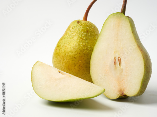 Green pear with a leaf isolated on white. Pear Clipping Path. Professional studio photo