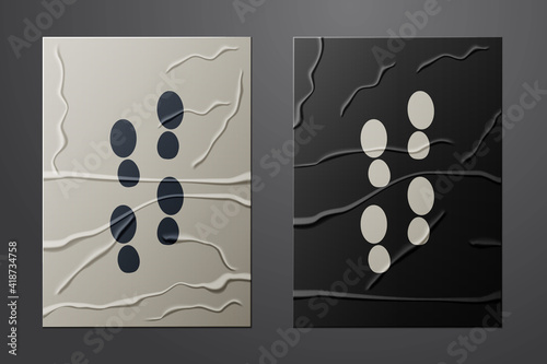 White Human footprints shoes icon isolated on crumpled paper background. Shoes sole. Paper art style. Vector.