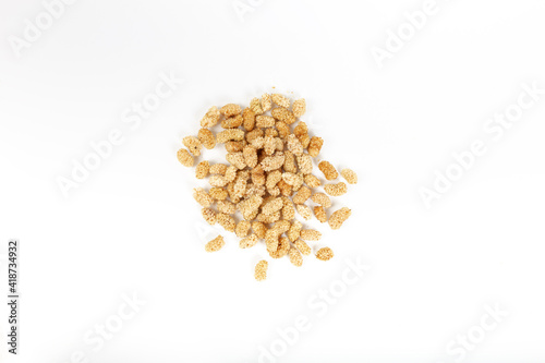 Dried mulberries isolated on white background.