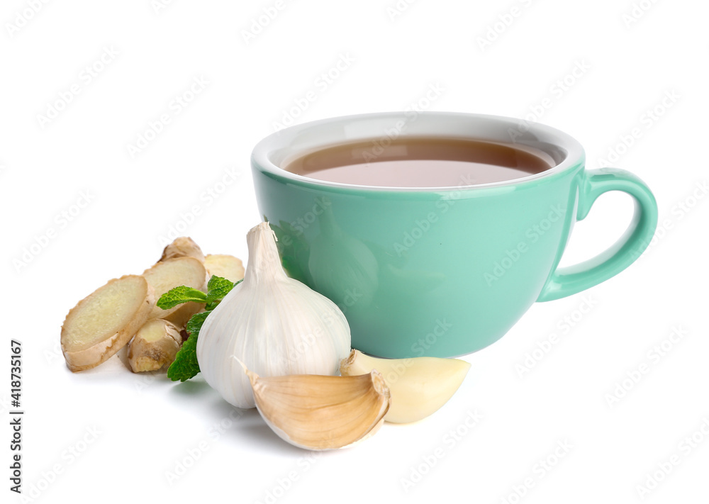 Cup of healthy garlic tea on white background Cup of healthy garlic tea on white background