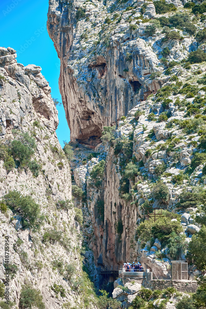 Naklejka premium Very narrow path in rocky canyon - mountain wooden path along steep cliffs in Andalusia, Spain