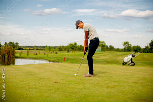 Young man playing golf