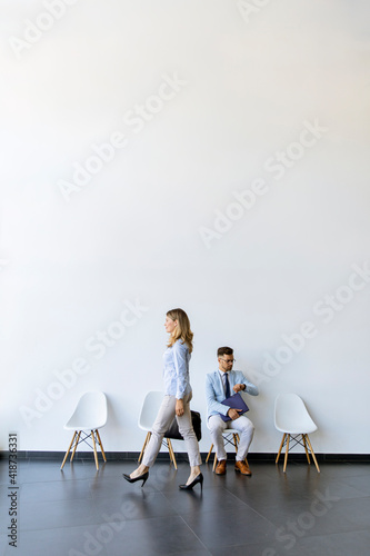 Businesswoman passing by yo...