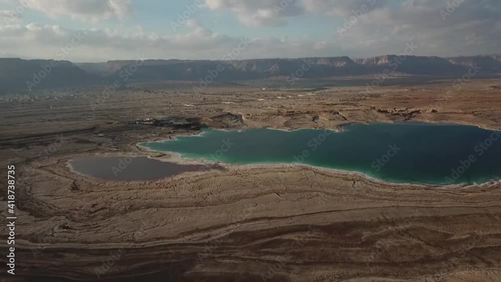 Spectacular aerial view of the Dead Sea and mountains behind it.
Cloudy day.
The lowest place in the world
Arava - Israel Spectacular aerial view of the Dead Sea and mountains behind it.
Cloudy day.
The lowest place in the world
Arava - Israel