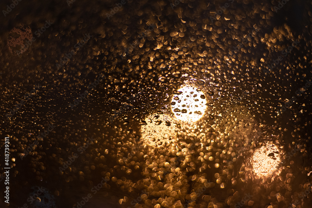 Blurred background with raindrops and lights. Blurred background with raindrops and lights.