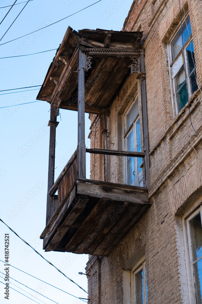 Old wooden balcony view from the street
