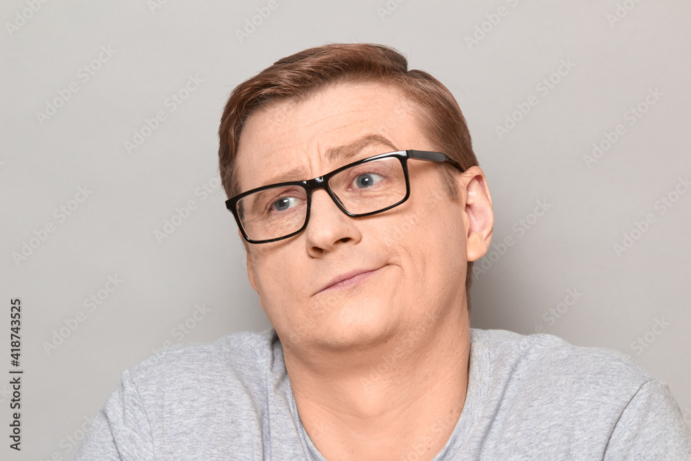 Portrait of tired disappointed blond mature man with glasses Portrait of tired disappointed blond mature man with glasses
