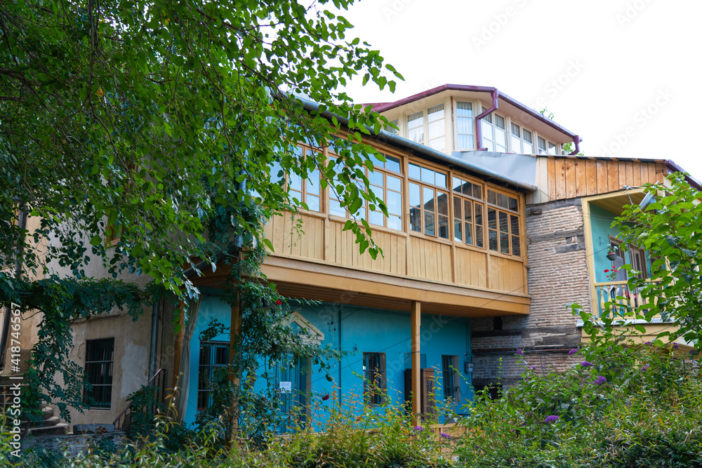 Wooden patterned balcony view from the street Wooden patterned balcony view from the street