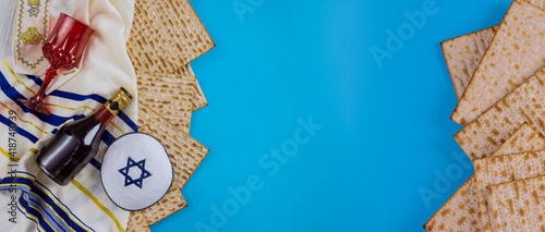 Jewish Passover attributes in composition a cup of wine and passover matzah