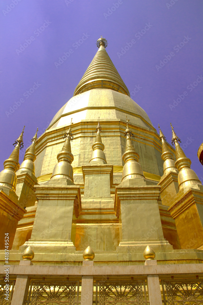Golden pagoda in Thailand. Blue Sky background