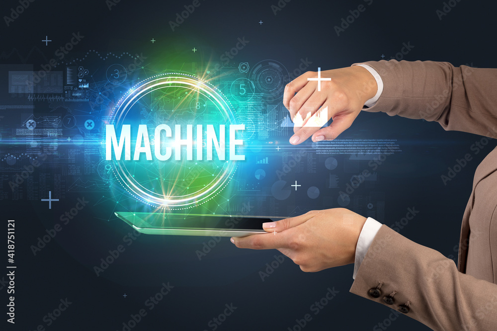 Close-up of a touchscreen with MACHINE inscription, new technology concept Close-up of a touchscreen with MACHINE inscription, new technology concept