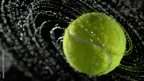 Water splashes from a spinning tennis ball © Juri