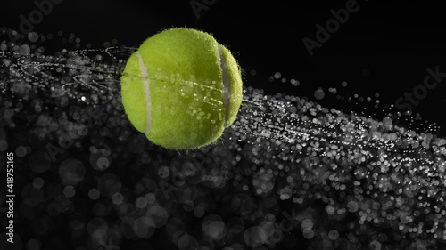 Water splashes from a spinning tennis ball © Juri