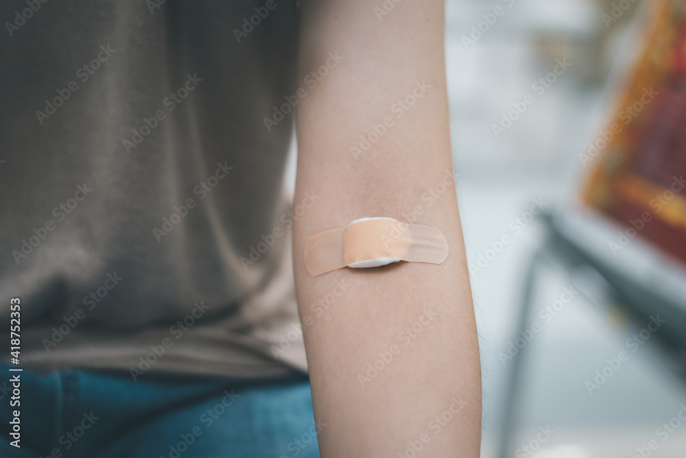 Plaster and cotton on woman arm after blood testing or blood donation.  Stock-Foto | Adobe Stock