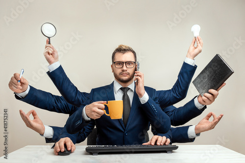 Businessman with many hands in a suit. Works simultaneously with several objects, a mug, a magnifying glass, papers, a contract, a telephone. Multitasking, efficient business worker concept.