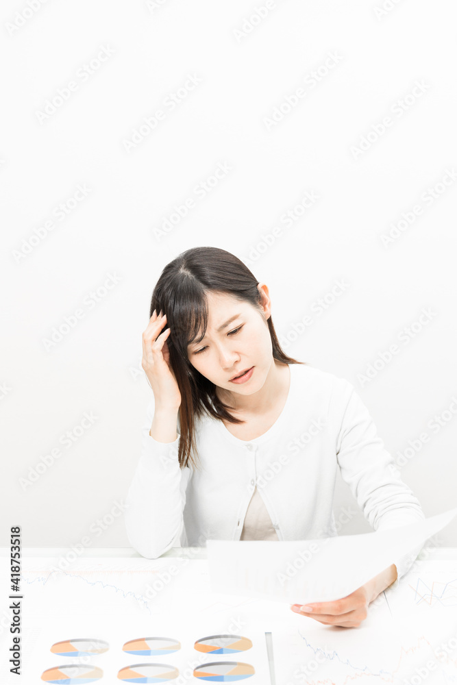 Woman thinking with a document at a meeting Woman thinking with a document at a meeting
