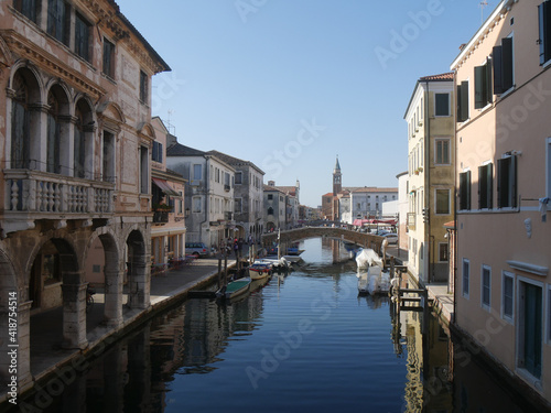 Chioggia, Vena Canal with colorful ancient buildings on both sides and Grassi Palace