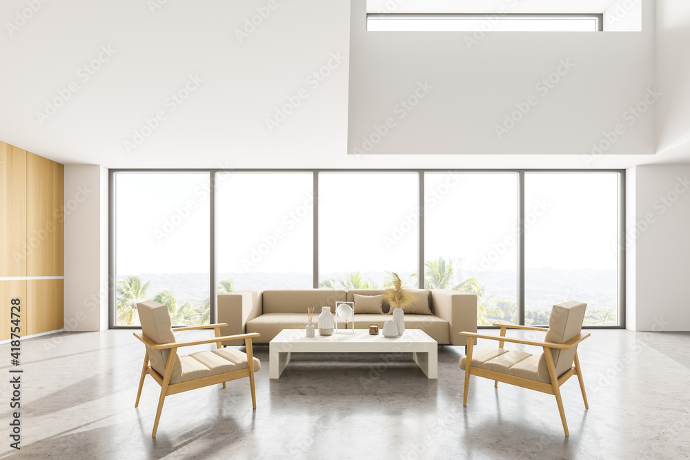 Light living room with sofa and armchairs near panoramic windows