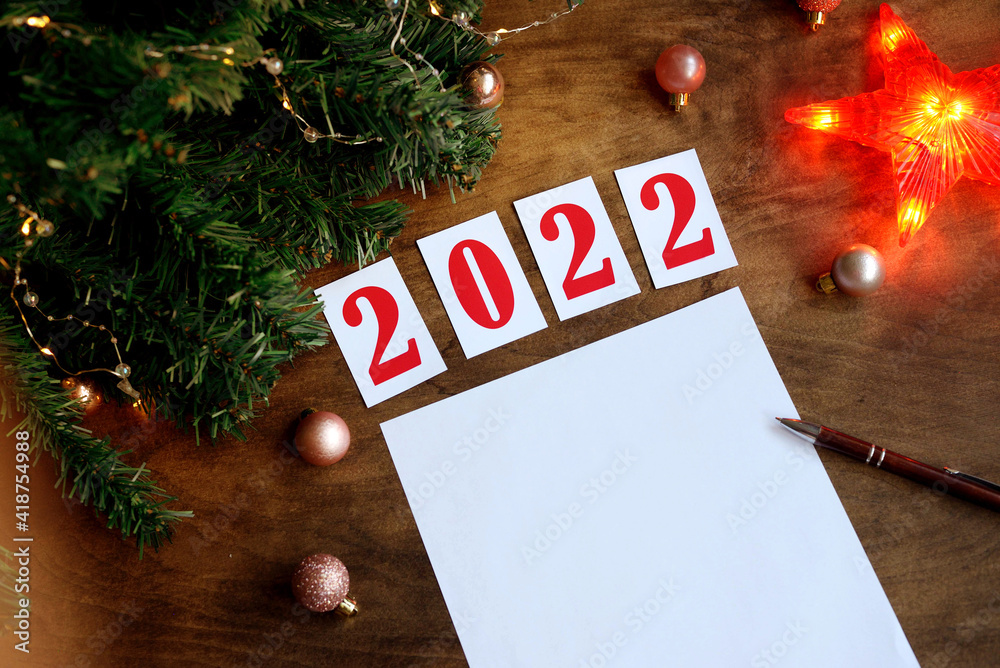 wish sheet on a wooden background with the numbers 2021, a blank sheet ...