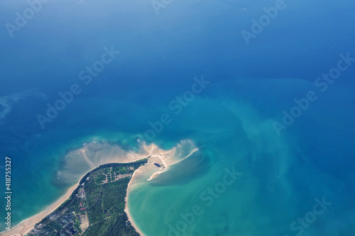 Aerial view by plane over island seashore in Phuket