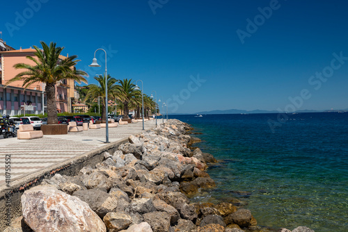 shore with cliff in porto santo stefano photo