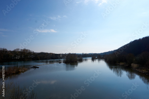 beautiful view of the neckar river in germany under a blue sky
