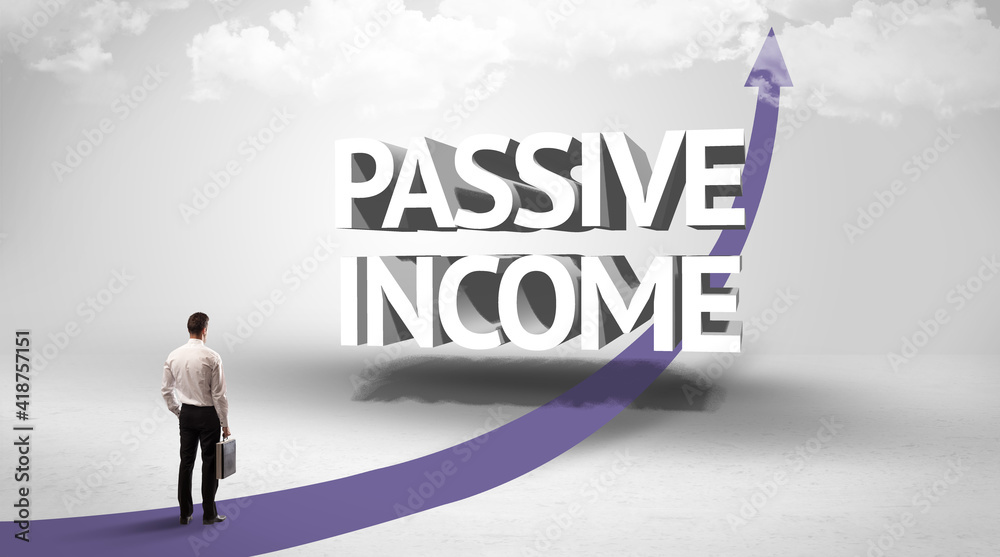 Rear view of a businessman standing in front of PASSIVE INCOME inscription, successful business concept Rear view of a businessman standing in front of PASSIVE INCOME inscription, successful business concept