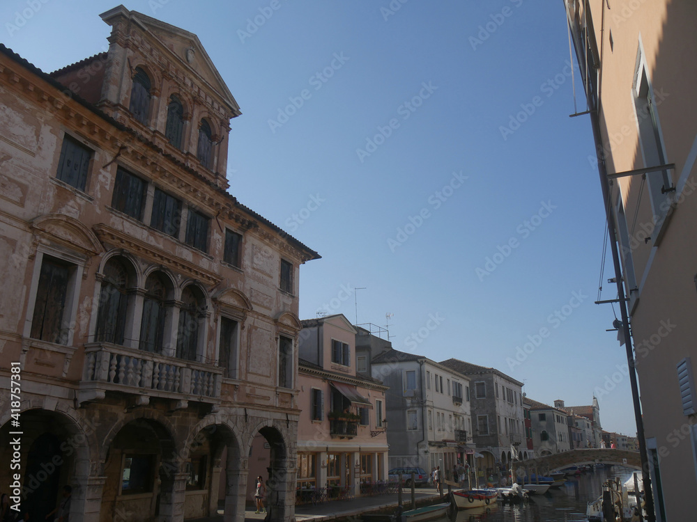 Chioggia, Grassi Palace with baroque facade with balconies and a triangular pediment along Vena Canal