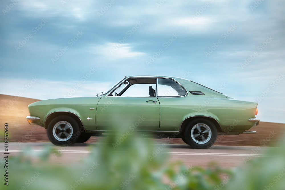 Fototapeta premium Vintage car on the road