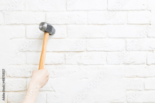 Hammer swung down against the wall