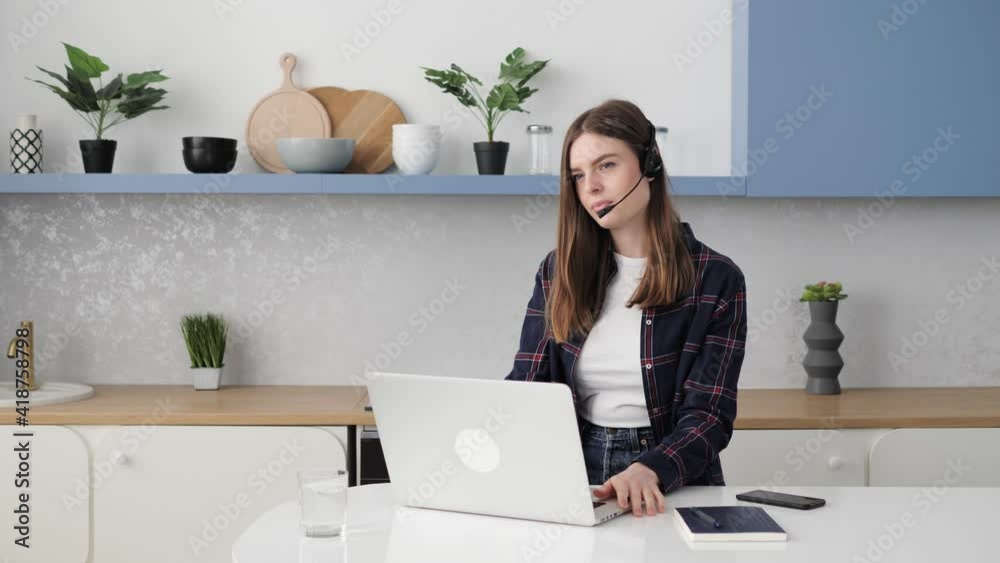 Close up of young attractive female call center worker talking to customer at helpdest online point. Technical support agent consulting giving information to client working remotely from home. Close up of young attractive female call center worker talking to customer at helpdest online point. Technical support agent consulting giving information to client working remotely from home.