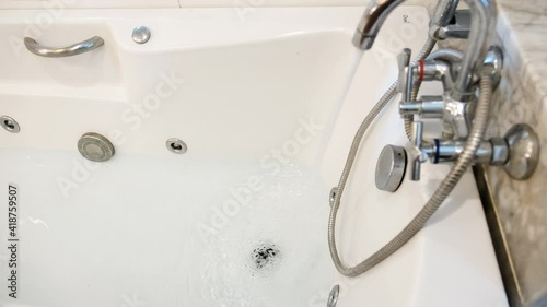 Modern Bathtub in Bathroom of luxury tropical. Hotel  Close Up Panorama