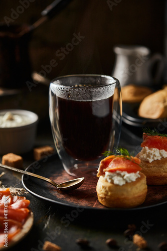 Americano coffee and salmon tartlet with cream cheese