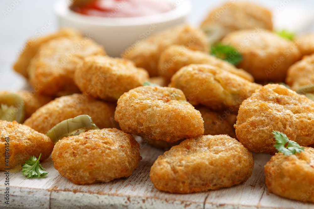 Crispy Jalapeno Popper with creamy cheese battered on white wooden board