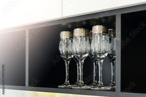 Beautiful glasses for wine, close-up. Modern kitchen design. Copispace. photo