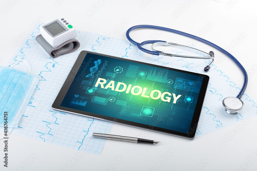 Tablet pc and medical stuff with RADIOLOGY inscription, prevention concept