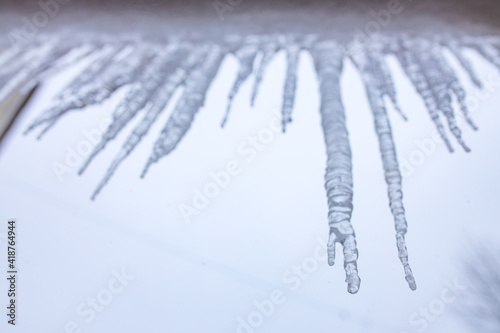 icicles hanging from a roof winter russian day