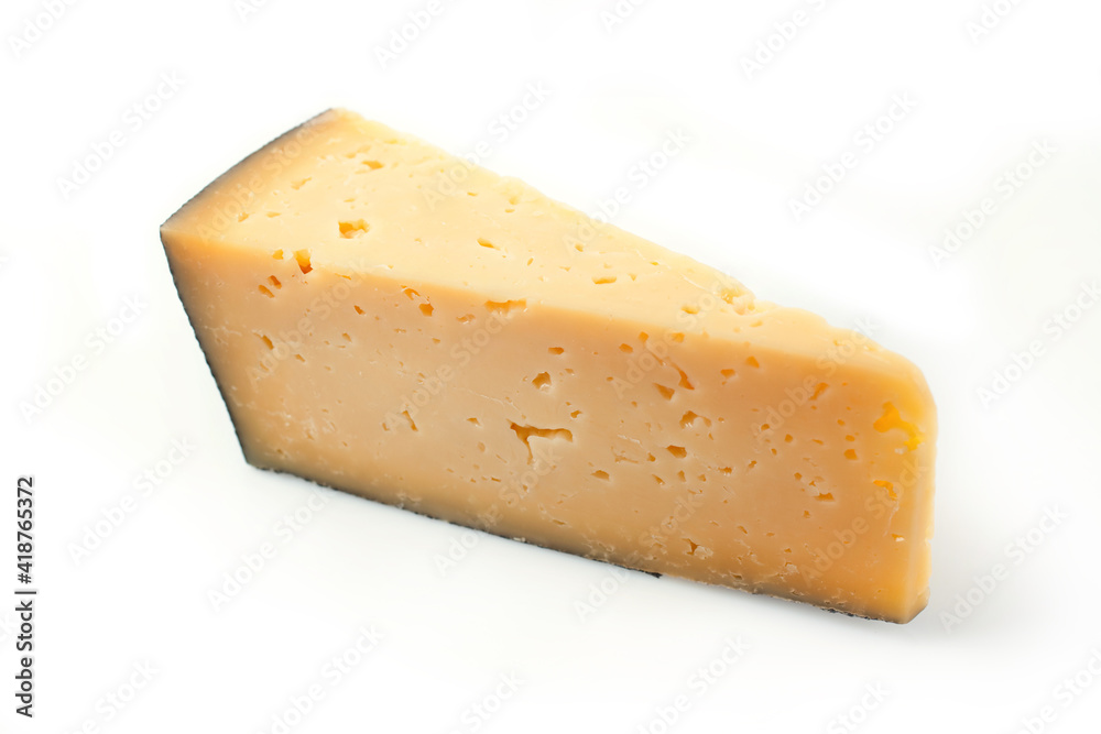 a piece of hard milk cheese on a white background
